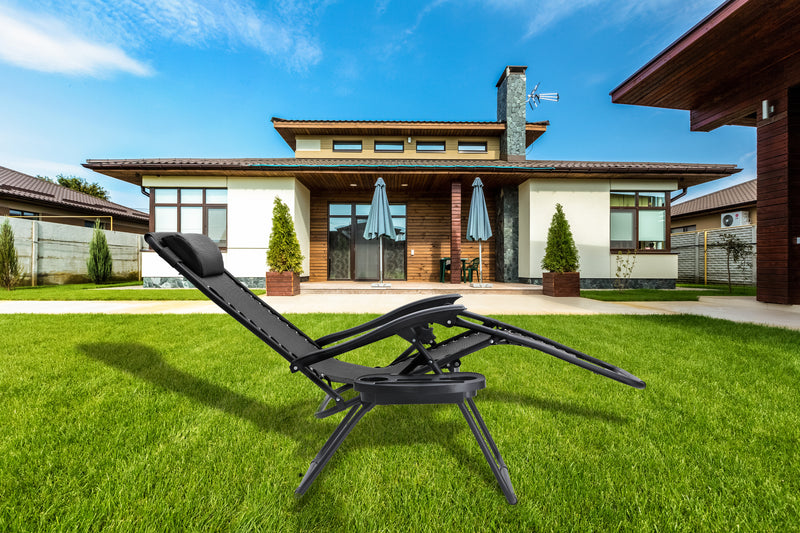 Straame Zero Gravity Chair in front of a house. Black reclining garden chair